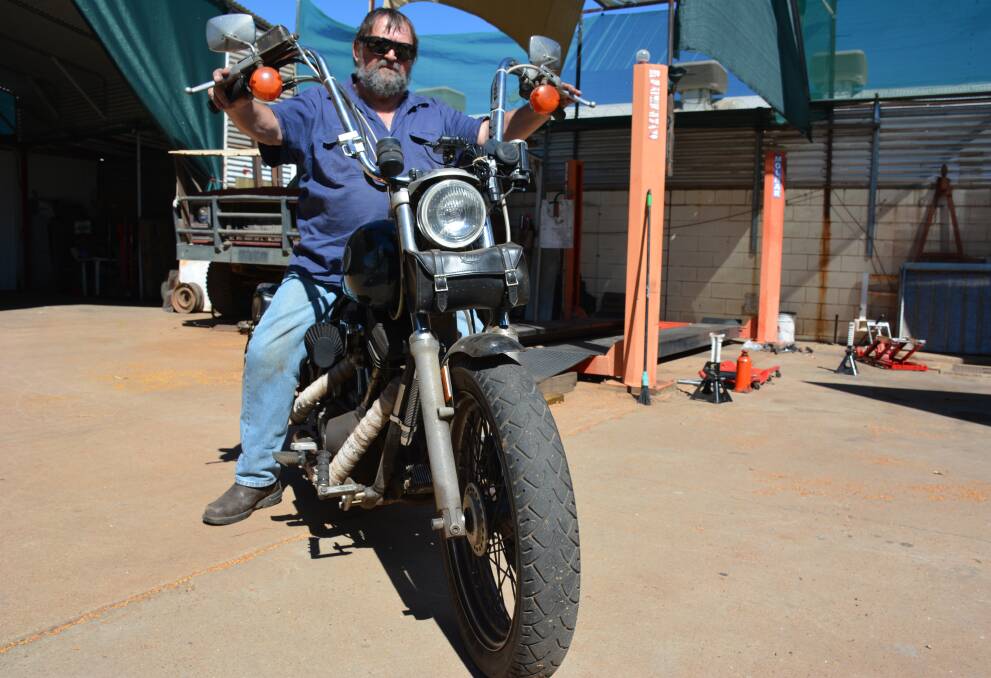 Mount Isa mechanic Urs Mueller on his Harley Davidson. Photo: Chris Burns. 
