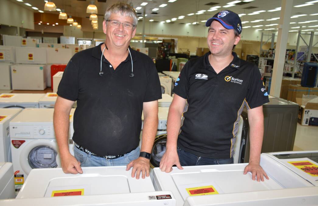 FRANCHISEES: Mount Isa's two Harvey Norman franchisees Brian Bower and Brad Sheppard in their new location. Photo: Chris Burns. 