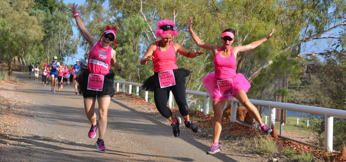 ENERGETIC FOR AWARENESS: Mel Rowland, Vicki Nicholson and Tammy Green race enthusiastically in the Pink Ta Tas fun run. Photo: Chris Burns. 