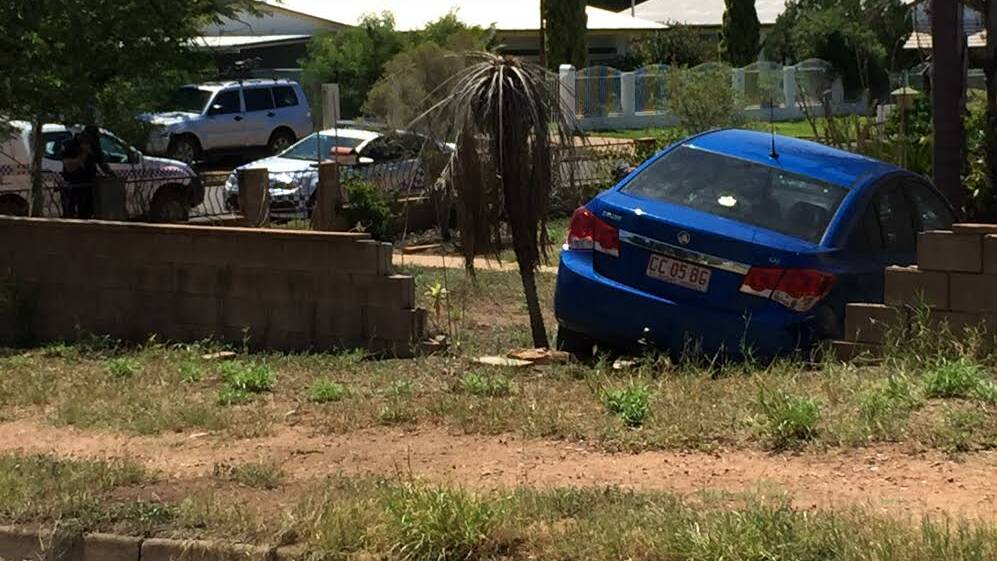 Crash: A car goes through a brick wall on Saturday afternoon. Photo: Contributed.