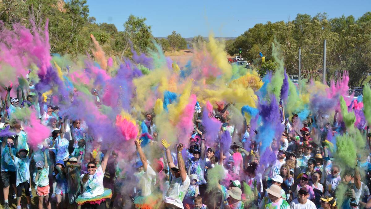ENDING: The crowd finish the event with a colour burst. Photo: Chris Burns. 