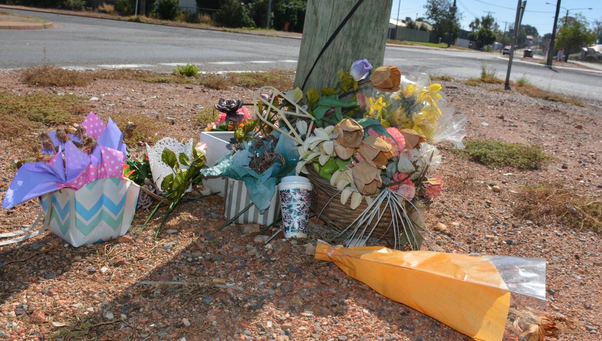REMEMBERED: The shrine for Che Mellick at the intersection of Camooweal and Zena Streets. Photo: Chris Burns.  