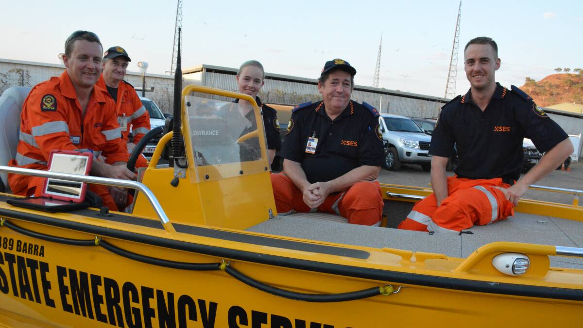 SES CREW: Gordon Sparks, Neil Paine, Evelyn Martens, Paul Smith and Eric Pedersen sit in the new boat during the official boat handover presentation. Photo: Chris Burns. 