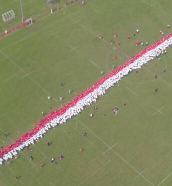 LINE-UP: The world's largest rugby scrum. Photo: Media Mayhem/Steady Hawk. 