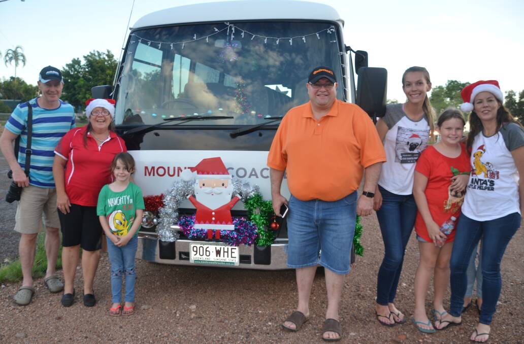 Guests on the Mount Isa Coaches bus, with business owner Gary Murray in the centre. 