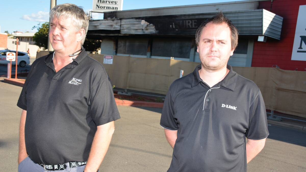 FRANCHISEES: Mount Isa's two Harvey Norman franchisees Brian Bower and Brad Sheppard in front of the burnt building in Marian Street. Photo: Chris Burns.   