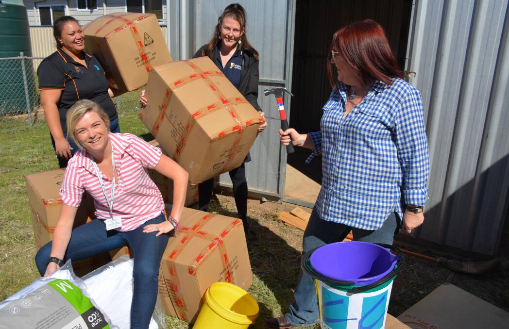 UPGRADES: Lena Mabbs, Jo Frame, Sally Wyld, and Leanne Harris clean and prepare the neighbourhood centre in Cloncurry. Photo: Chris Burns. 