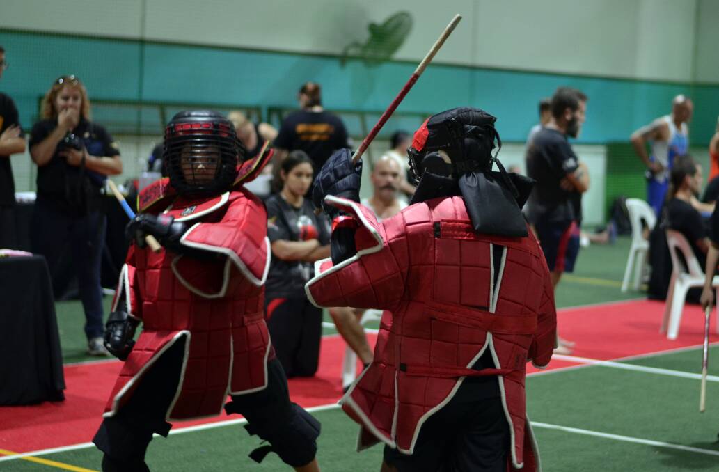 FIGHT: Patrick Roche fights in the gold medal final of the male 13-14 years single stick Eskrima. He is among the Sikaran fighters to qualify for the world championship in Hawaii. Photo: Chris Roche.