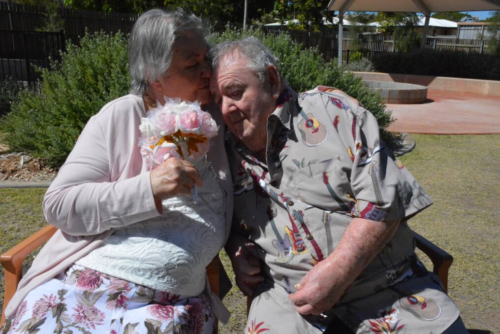 Edna Ormonde kisses her husband John in the grounds of the Laura Johnson Home. Photo: Chris Burns. 
