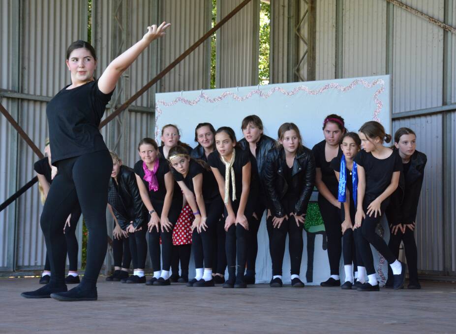 SHOW TIME: Cloncurry's Saint Joseph's Catholic School Year 8 student Louise Waters rehearses with the rest of her troupe at Tony White Oval in preparation for the Rock, Pop, Mime Show at Tony White Oval. Photo: Chris Burns. 