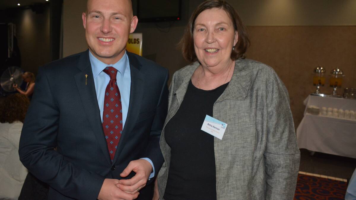 Treasurer Curtis Pitt catches up with former Mount Isa State Member Betty Kiernan last July, as part of his regional budget tour. 