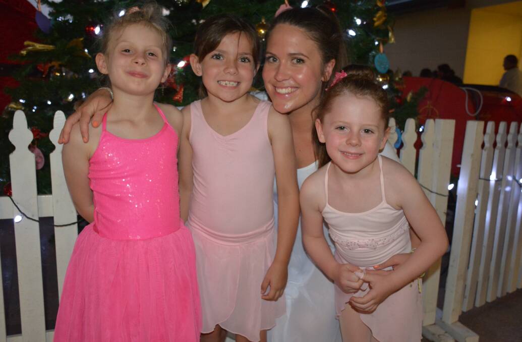 Joyful: Chloe Williams, 6, Kirsty Tuttle, 7, ballet instructor Emily White and Belle Fleming, 5, congratulate each other on a great performance. 