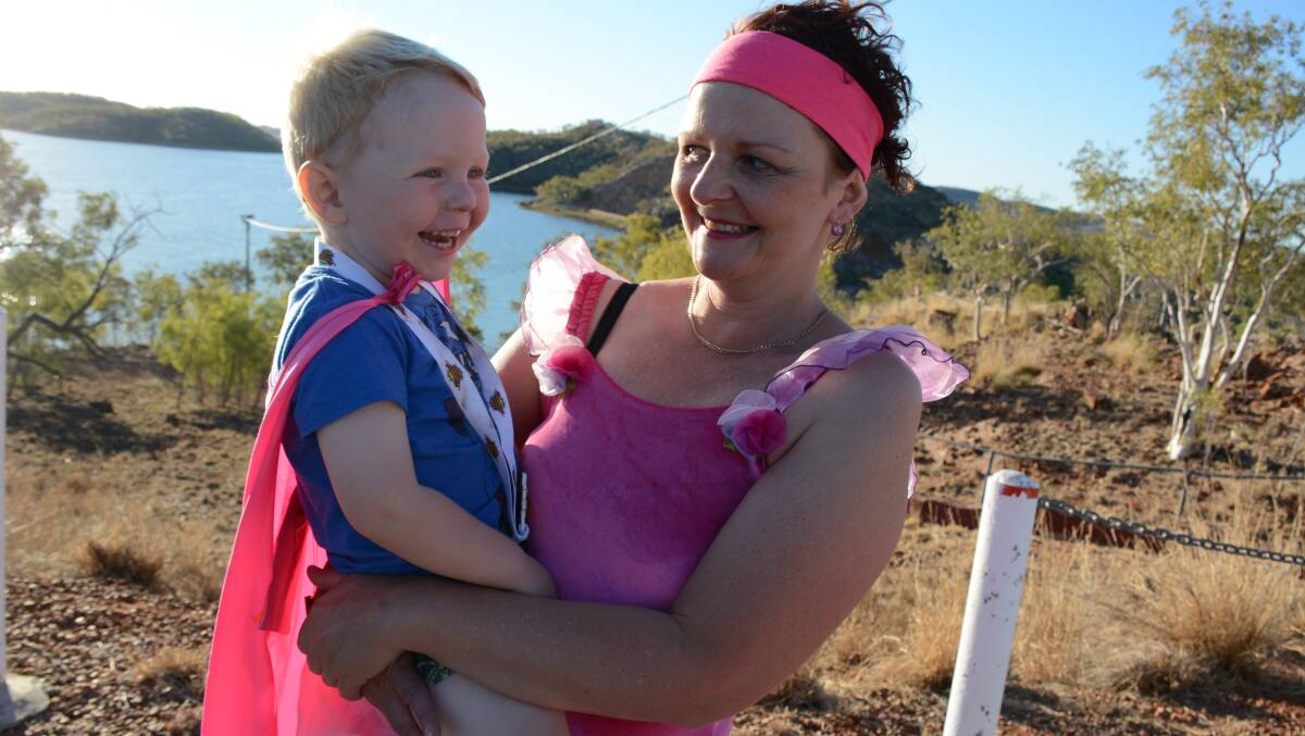 READY TO RUN: Ashton Godwin, 3, held by his mother Juanita, who was diagnosed with breast cancer last year. "I haven't got any concerns for the future," she said. "My oncologist said I had a very bright outlook." Photo: Chris Burns. 