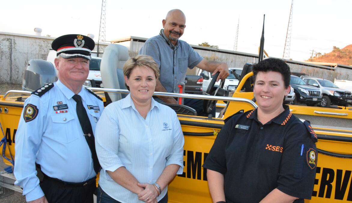 SES area controller Gordon Graham, Glencore-MIM representative Maryann Wipaki, Mount Isa councillor George Fortune, and SES local controller Kim Smith check out the new boat for the emergency service. Photo: Chris Burns. 