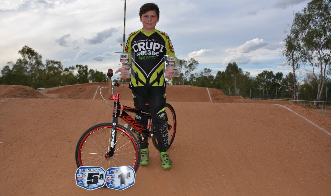 NATIONAL CHAMP: Island BMX Club's Bill Woodward holds his trophies and the plates he won at the national championship held in Brisbane last week. Photo: Chris Burns. 
