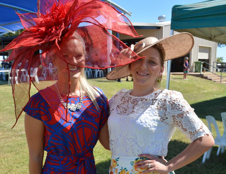 Women's fashions on the field winner Chelsea Salisbury and Emma Scott at last year's Luau Races. Chelsea designed her own flower pattern millinery. 