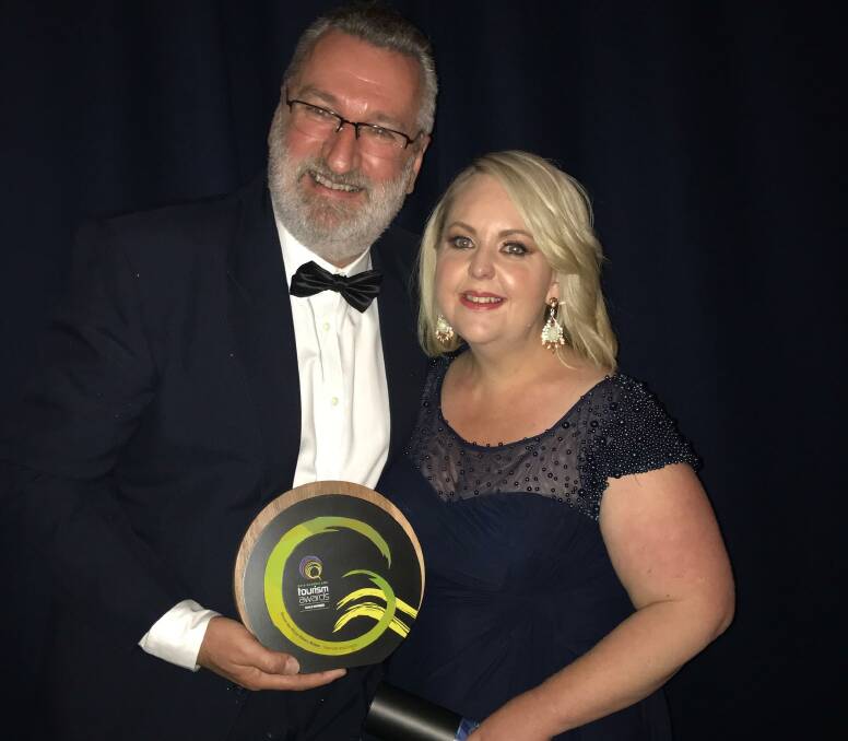 ACKNOWLEDGED: Mount Isa Rotary Rodeo committee president Darren Campi and manager Natalie Flecker collect their category's gold award in Brisbane. Photo: supplied.