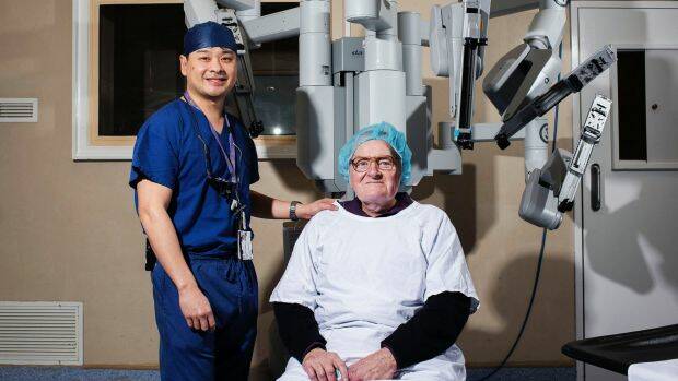 Dr Ronald Chin with patient Brian Hodge who was spared six months of recovery and disfiguring scars following robotic surgery at Nepean Hospital. Photo: Christopher Pearce
