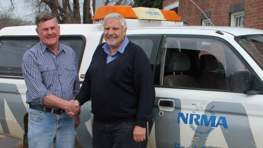 COLLEAGUES AND FRIENDS: John Chambers (right) bids Paul Basham thank you and good luck as he retires following 36 years in the SG Chambers workshop and NRMA vehicle. Picture: Jennette Lees