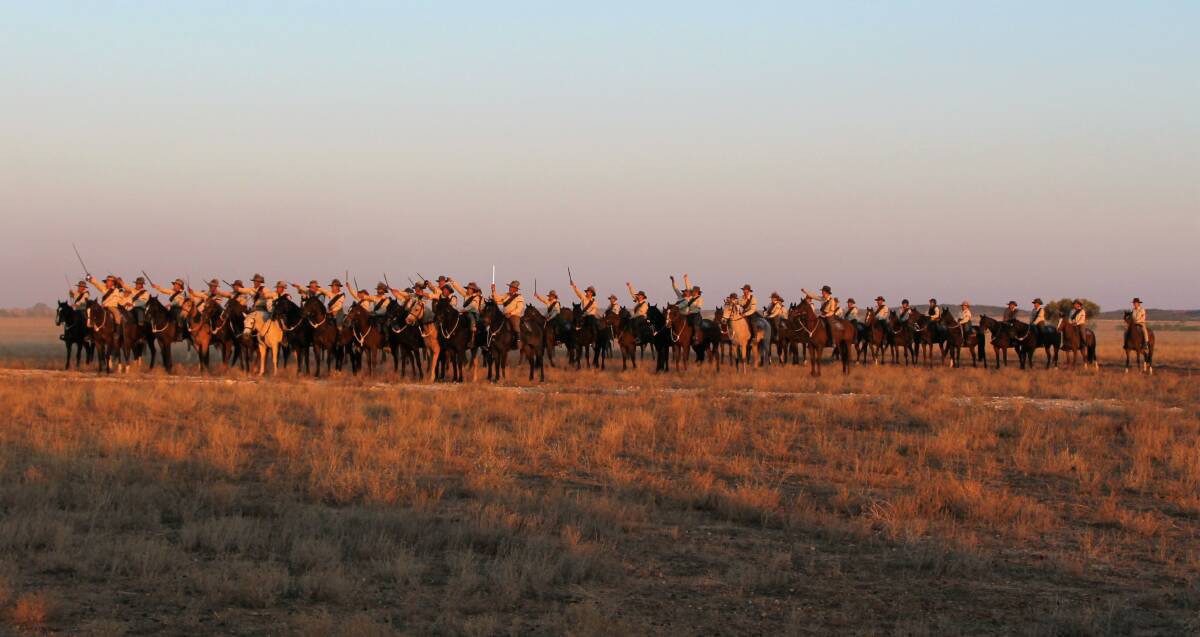 Confronting: After a gallop across the plains, the re-enactment troop halted and drew their mock bayonets to salute onlookers at the sunset extravaganza dinner at Bladensberg National Park. Pictures: Sally Cripps.