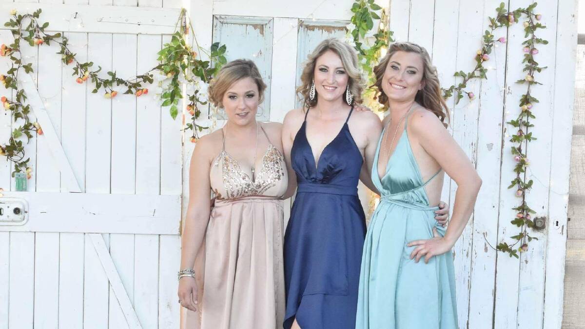 Demi Keating, Rachel Atkinson and Lacee Marquis had their boots and bling on for a night of kicking up their heels.