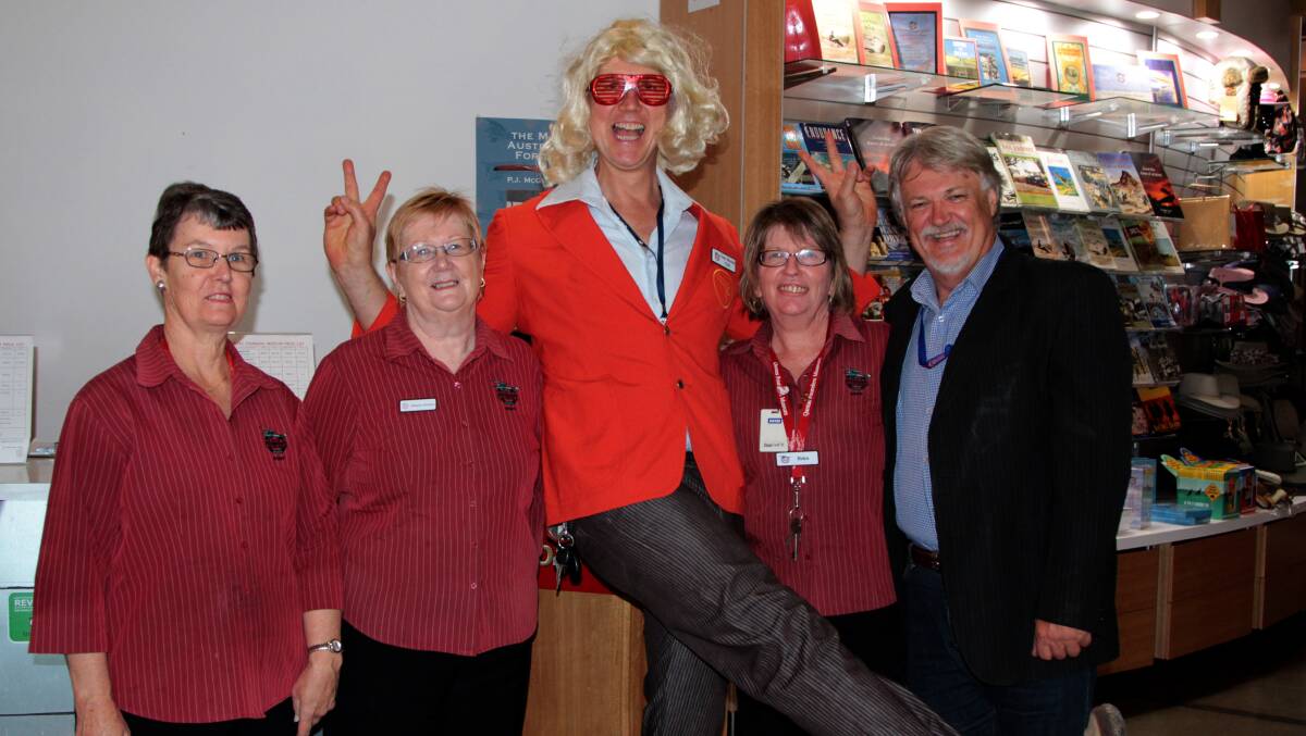 Qantas Founders Outback Museum CEO Tony Martin in the 1970s theme with board member Tony Edwards and staff Kate Duncan, Alleyne Johnson and Tony Martin.