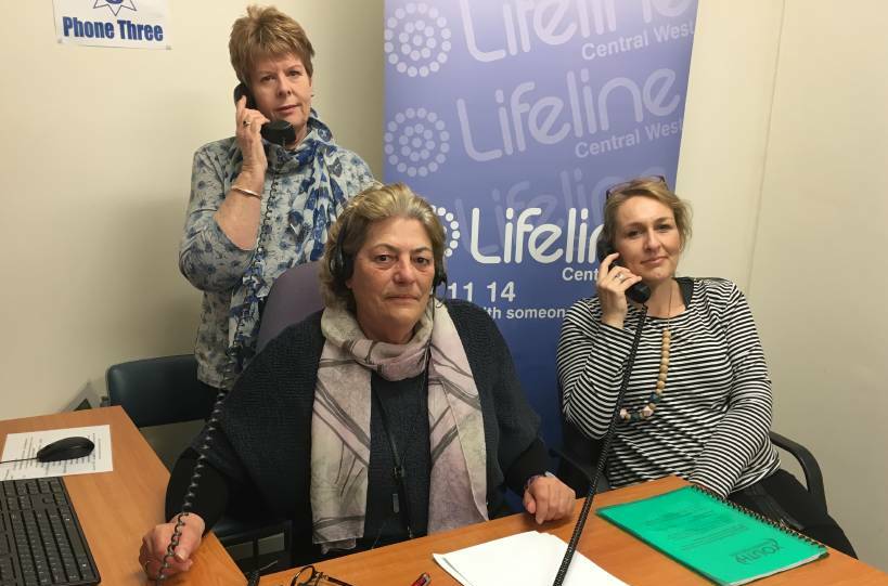 HERE TO LISTEN: Lifeline Central West crisis supporters Astrid Taylor, Stephanie Robinson and (back) Vicki Byrnes are part of a marathon effort to answer as many calls for help as possible. Photo: NADINE MORTON
