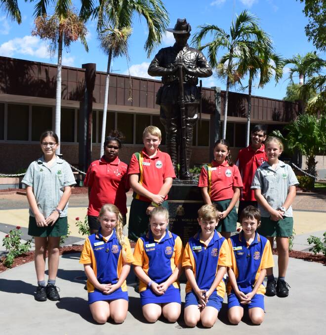 VOLUNTEERS: Student volunteers from across five Mount Isa schools have been hard at work researching and restoring Anzac diggers' graves. Photo: Danaella Wivell 