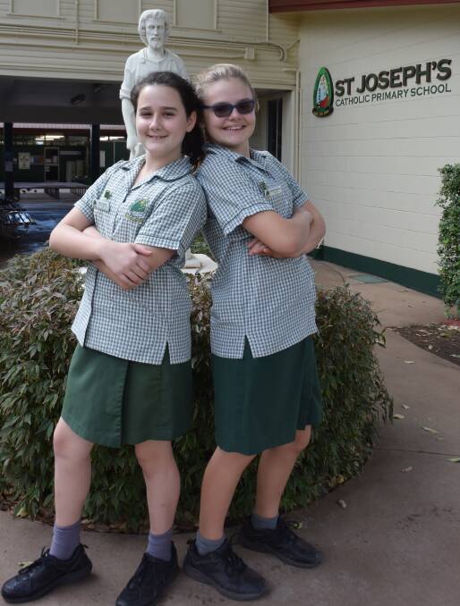 READY FOR DEBATE: Grade six students Ella Coghlan and Sophie Greenhalgh are pumped to debate on school hours, healthy eating, and education opportunities. Photo: Danaella Wivell 