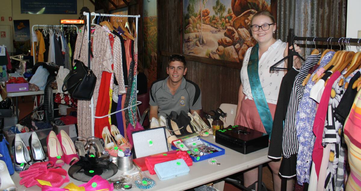 TOO NEW: Rodeo Queen Quest entrant Alison Gibbs and partner Brentten Scrivener sell designer and high street labels at Outback at Isa on Sunday. Photo: Esther MacIntyre
