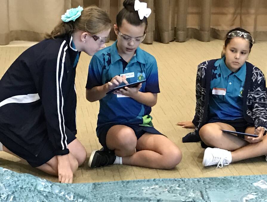 DIGITAL INCLUSION: These girls participating in another workshop called 'WiFi on Everything' at the Digital Skills Roadshow in Cairns. Photo: supplied