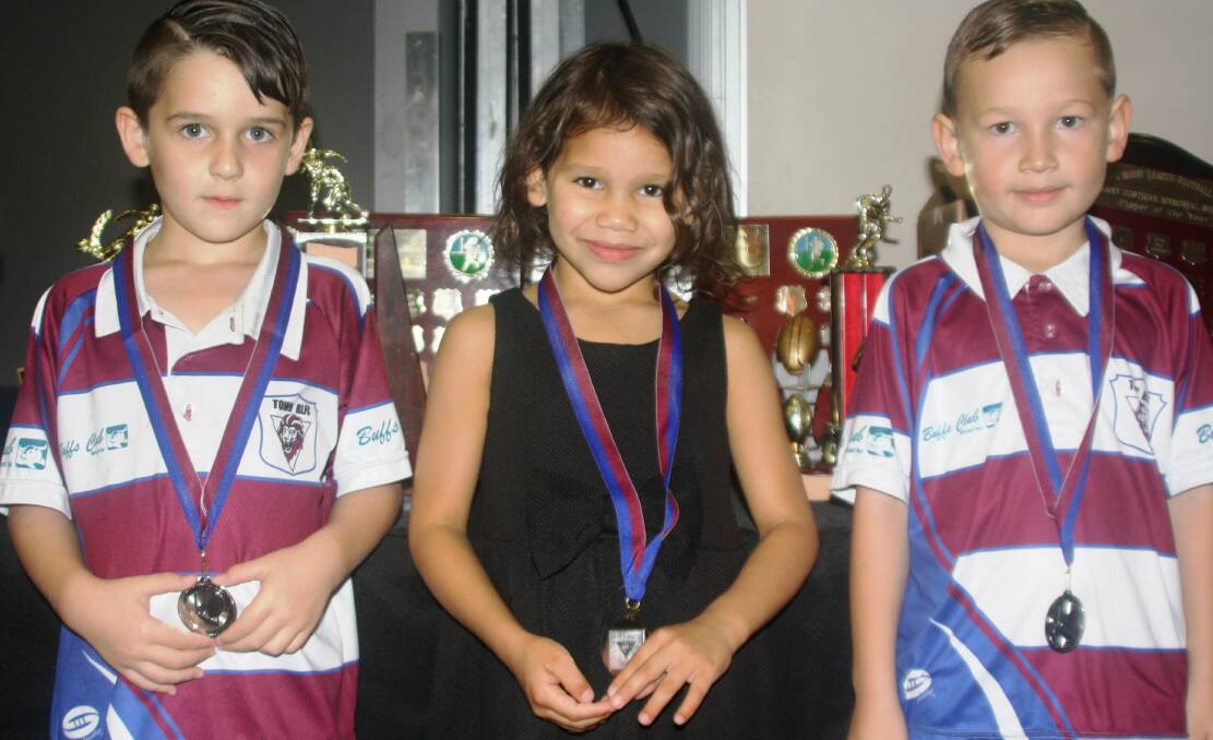 RUGBY KIDS: Under 6 Townies players Mason, Olivia, and Koby receive their medals. Photo: Esther MacIntyre