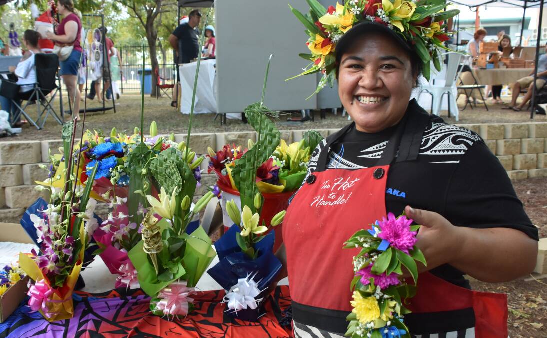 AFFORABLE FLORALS: Toots from Mount Isa Florist, via the Cook Islands, was selling $2 wrist 0has been in Mount Isa for seven years. Photo: Esther MacIntyre