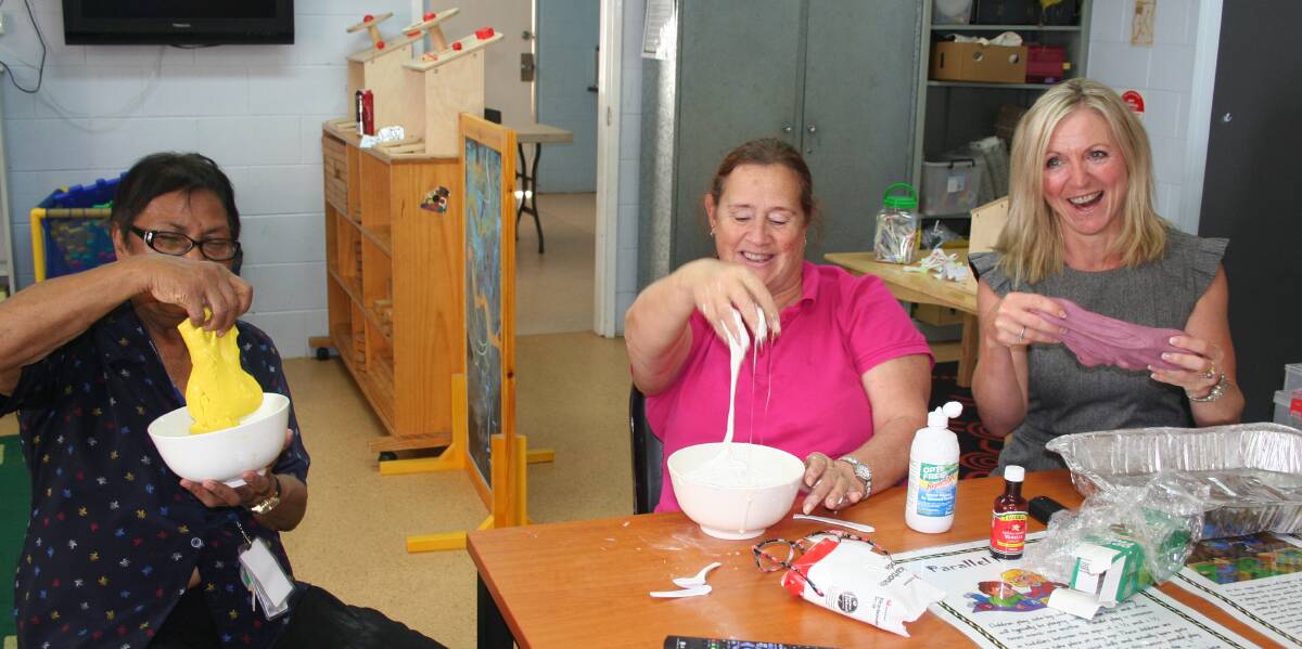 Playing with slime – Aunty Fran Page, Brilla Brilla Childcare Coordinator Val Hendriks and Lisa Davies Jones. Photo: supplied
