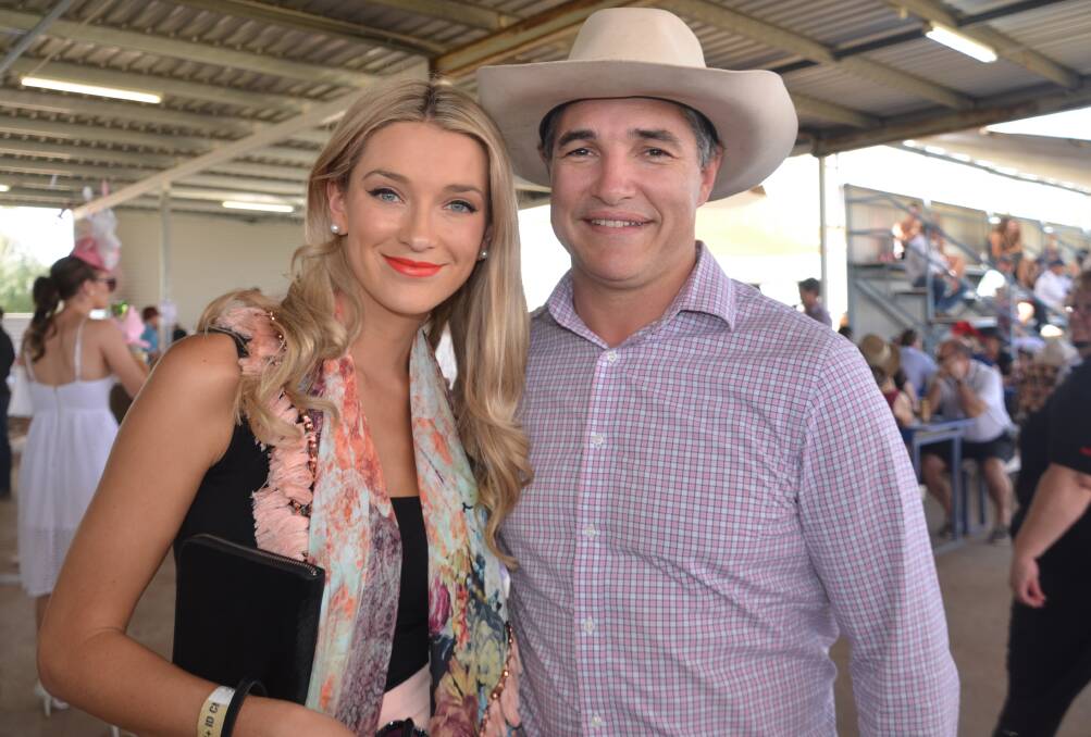 TYING THE KNOT: Daisy Hatfield with her soon-to-be husband, State MP Robbie Katter, socialising at the Julia Creek races last year. Photo: Derek Barry