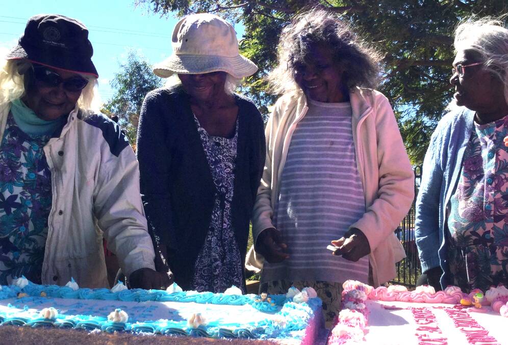 WELCOME TO COUNTRY: Doomadgee elders and two spectacular welcoming cakes. Photo: supplied