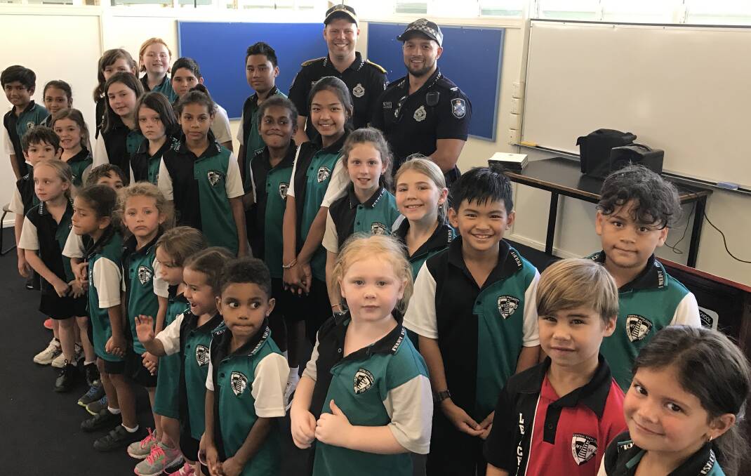GREAT TEAM:  Mount Isa Central School students with their adopt-a-cops Constable Allan Heldsinger and Police Liaison Officer Mark Stanton. Photo: supplied
