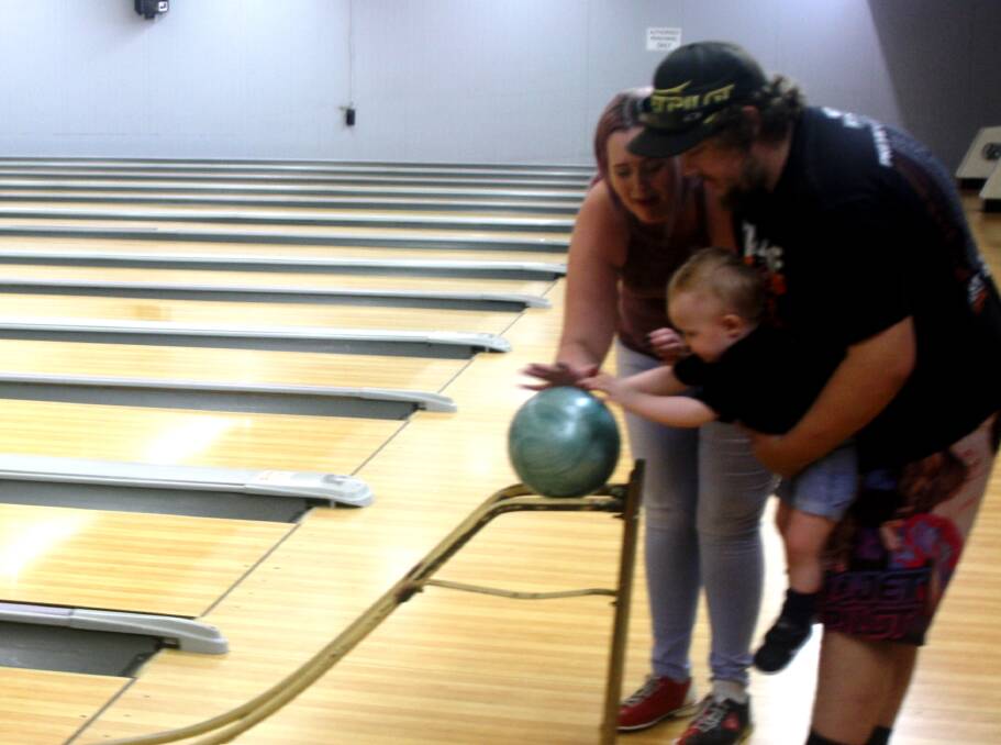 TEN PIN: Family time at the bowling alley, amongst the Saturday singles league at Mount Isa Ten Pin Bowling Alley in Pioneer. Photo: Esther MacIntyre