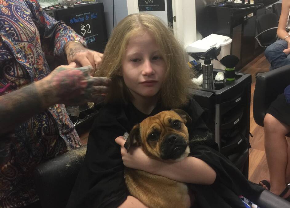 Eight-year-old Ava Lyon has raised money for Prader Willi Syndrome by having her lovely locks shaved off. Photo: supplied