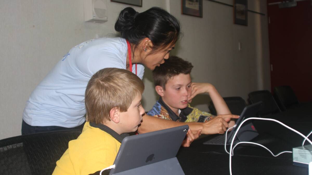 Coding Kids mentor Emily de la Pena helps Boulia students with the basics of learning how to code. 