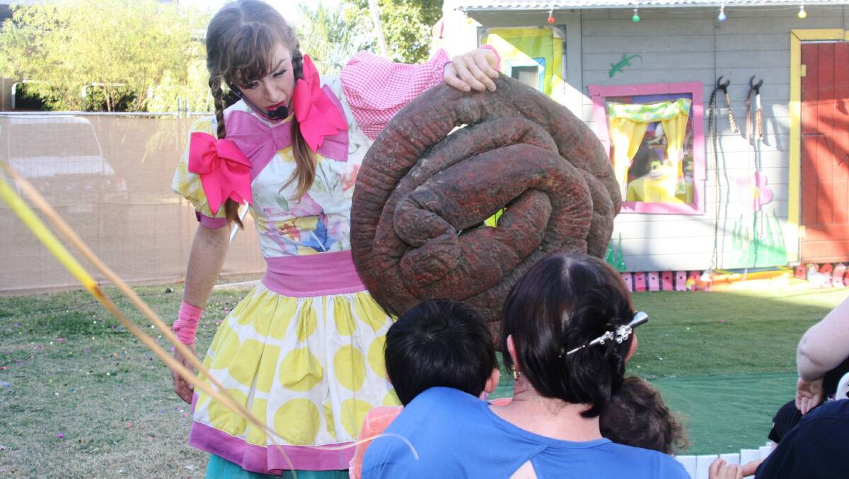 CRAPPY JOKE: S.T. Ruth brandishes a giant turd, leaving frightened children in its wake. Photo: Esther MacIntyre