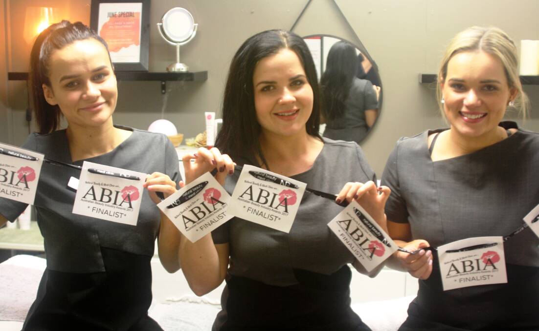 BEAUTY BUFFS: Natural Beauty's owner and therapist Reegyn Lea McElligott (centre) is thrilled to have her salon nominated for the Australian Beauty Industry Awards.