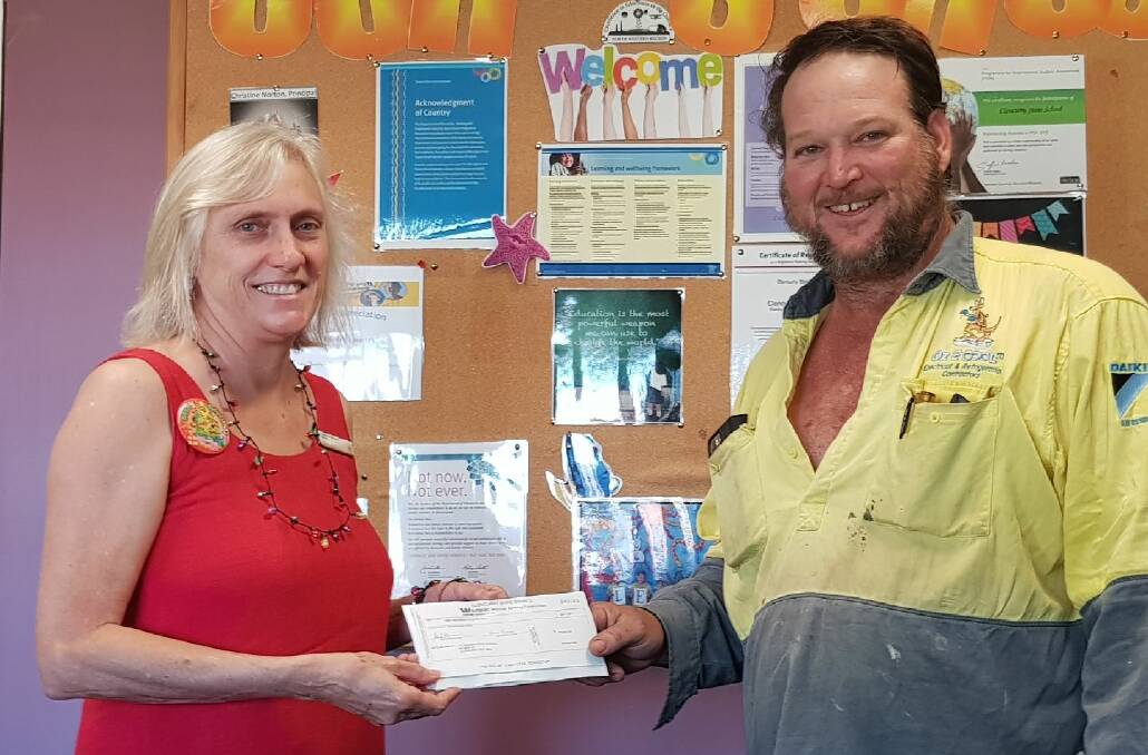 COMMUNITY BENEFITS: Councillor Damien McGee (right) donated his entire remuneration increase to Cloncurry State School’s Building Fund. Photo supplied.