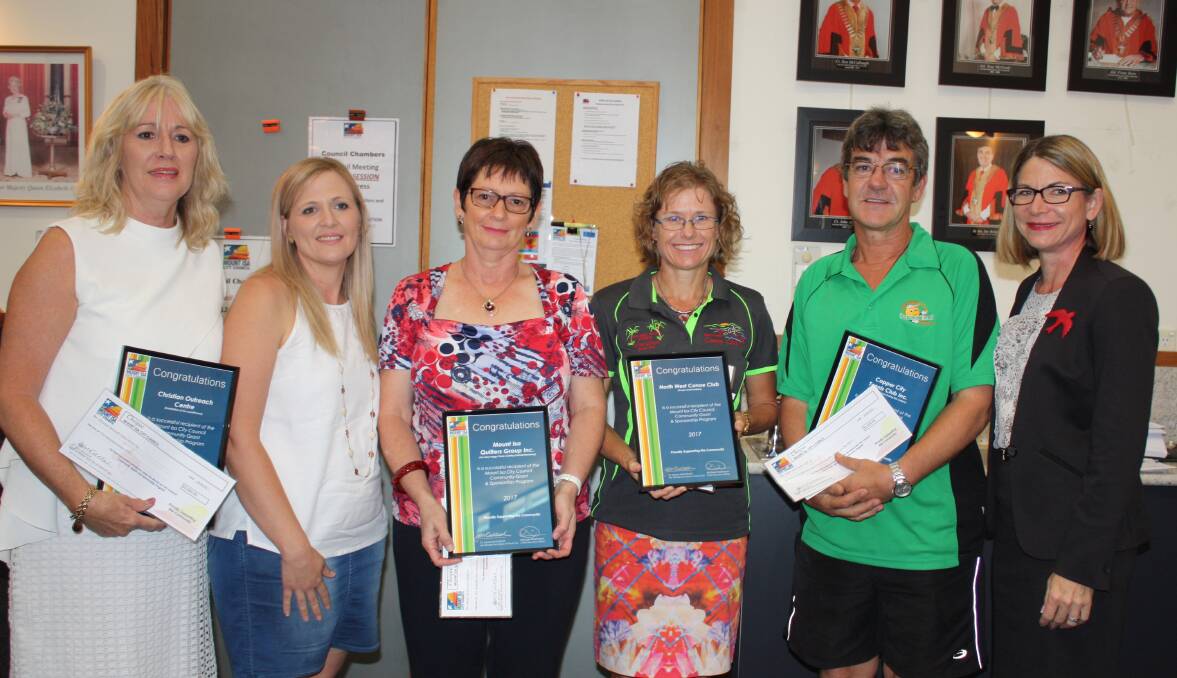 GRANTED: Christian Outreach Centre, Lynette Christie and Nicole Pyke; Dianne Maschke, Mount Isa Quilters Group; Alison Whitehead, North West Canoe Club; Brendon Bowler, Copper City Tennis Club; Mayor Joyce McCulloch. Photo: supplied