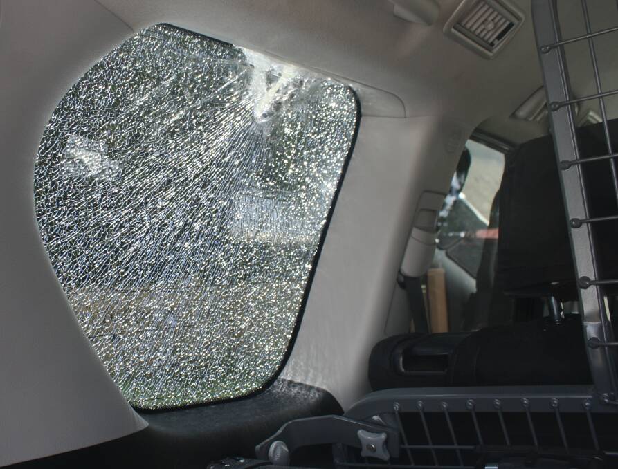 DIRECT HIT: The largest rock thrown at the couple's car went through the back passenger window, hitting the metal cargo barrier just inches from their son's head. Photo: Esther MacIntyre