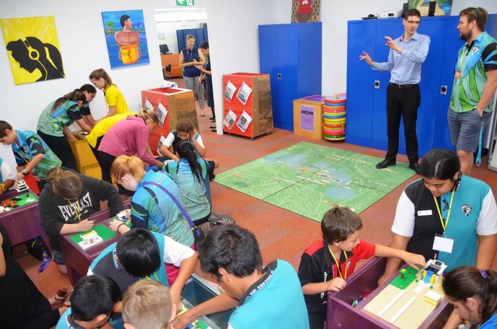 CITY PLANNERS: "What do you mean, we have to tear them down?!" Central State School students realise their architectural dreams in The National Capital Authority’s travelling Lego exhibition. Photo: Esther MacIntyre