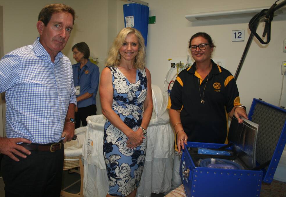 CUDDLE COT: Checking out the blue box, NWHHS Board Chair Paul Woodhouse, Chief Executive Lisa Davies Jones and Rotary President, Tracy Pertovt. Photo: supplied