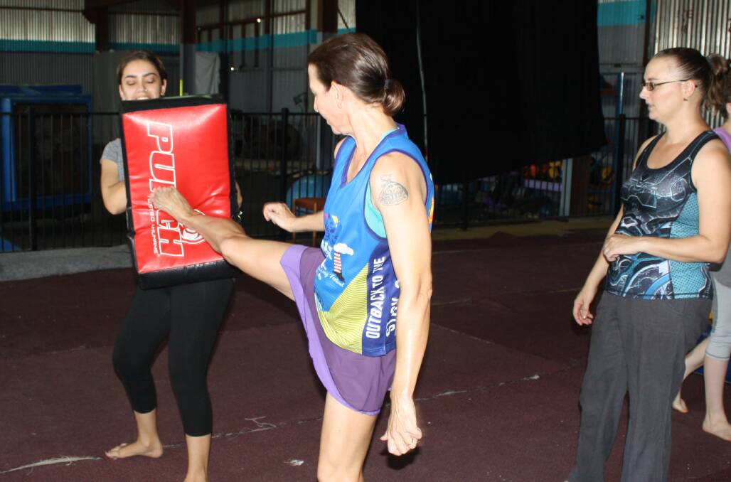 FOR KICKS: Two students sparr with a new kicking technique taught by Nadia (right) who takes classes for small groups of women. Photo: Esther MacIntyre
