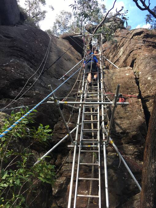 Ascending the Blue Mountains by ladder on the Ultra Trail Australia run.