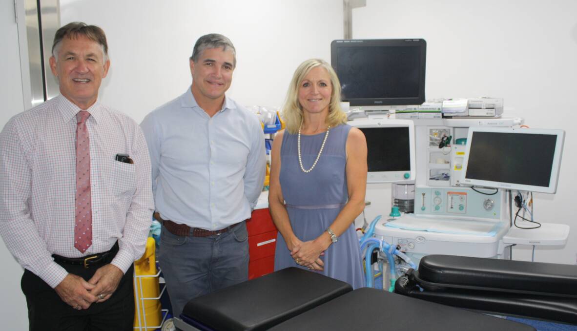 Deputy Mayor Phil Barwick, State MP Robbie Katter, NWHHS chief executive Lisa Davies-Jones attend a walk-through of the mobile theatre units. Photo: Esther MacIntyre